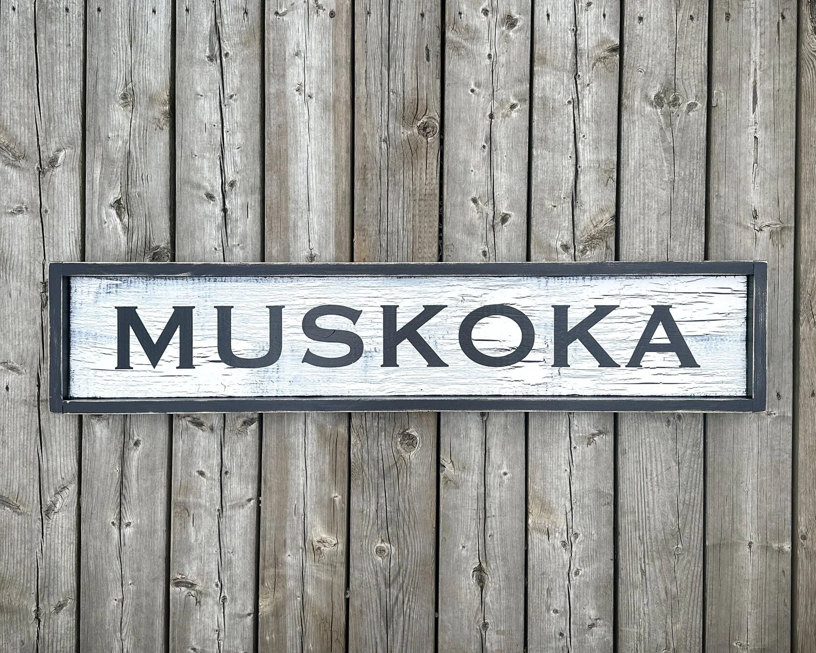 Muskoka sign on weathered timber from the existing MLS website